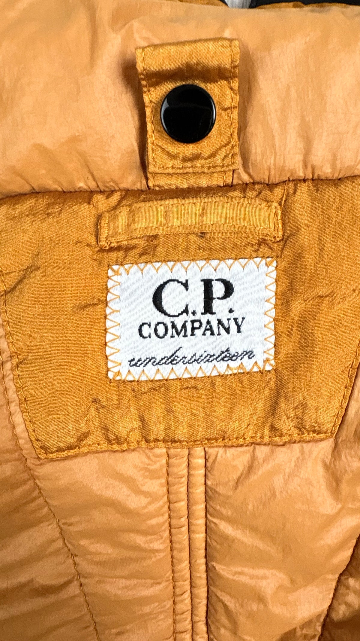 C.P Company Undersixteen Explorer Goggle jacket, camel and black, labels and finishing detail — view 4